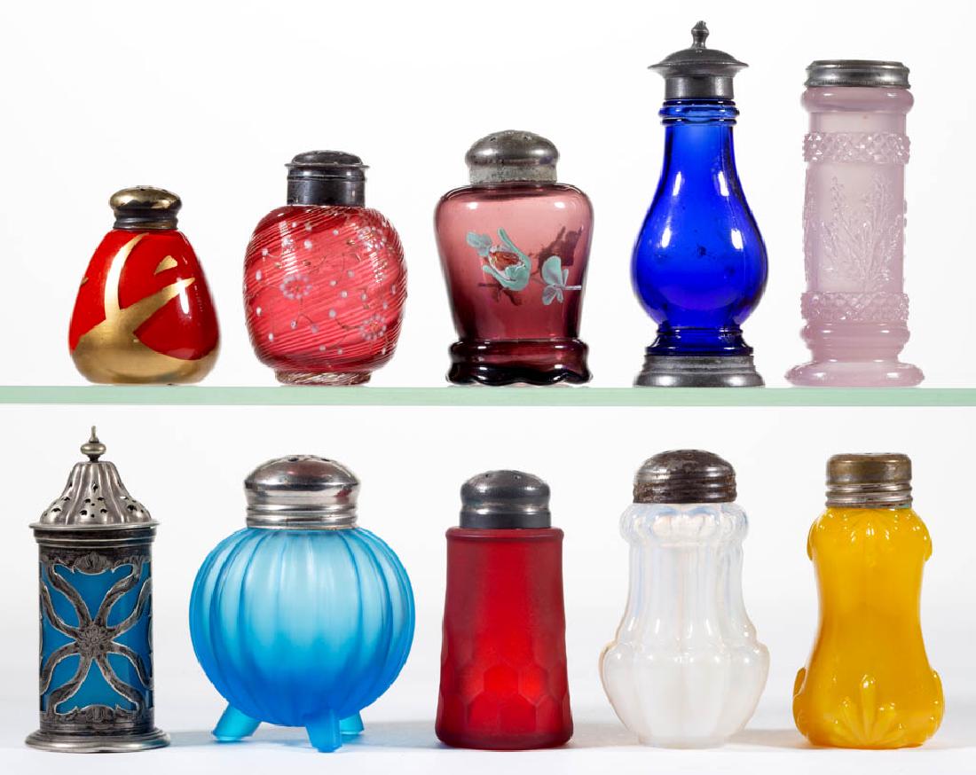 ASSORTED GLASS SALT AND PEPPER SHAKERS, LOT OF TEN: ASSORTED GLASS SALT AND PEPPER SHAKERS, LOT OF TEN, various colors, including metal caged, Consolidated Triple Rib, and Dithridge Double Fan Band examples. Various makers. Late 19th/early 20th century