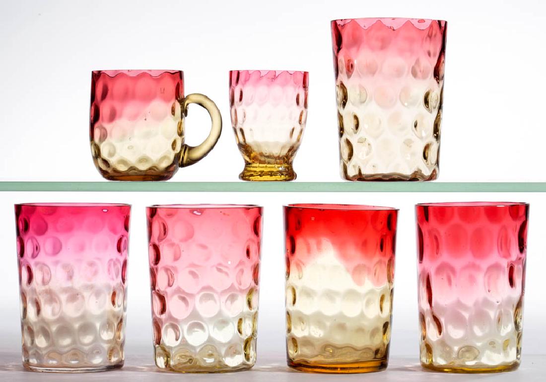 ASSORTED AMBERINA SPOT-OPTIC ARTICLES, LOT OF SEVEN: ASSORTED AMBERINA SPOT-OPTIC ARTICLES, LOT OF SEVEN, comprising five tumblers, a punch cup, and a toothpick holder. Various makers. Fourth quarter 19th/early 20th century. 2 1/2" to 3 3/4" H.Undamaged