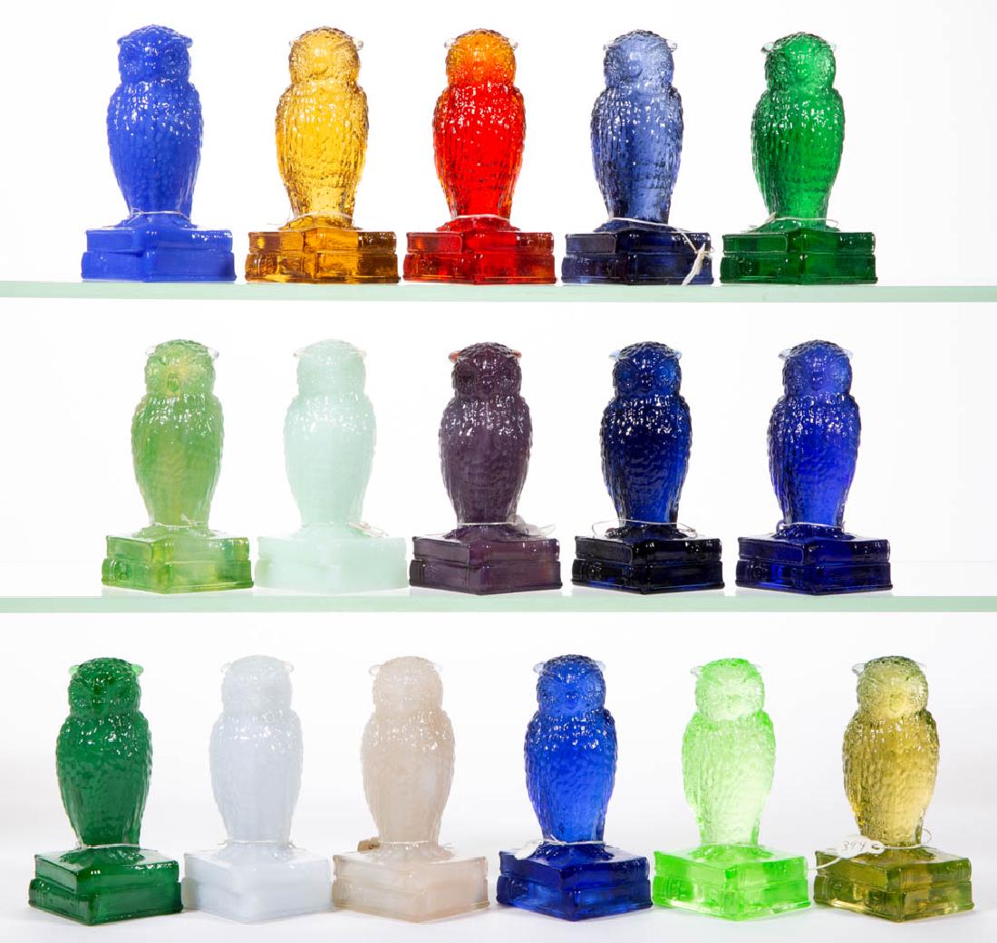 DEGENHART GLASS OWL FIGURES, LOT OF 16: DEGENHART GLASS OWL FIGURES, LOT OF 16, various colors, including louise lavender and unique blue. Each with Degenhart "D" mark. Crystal Art Glass Co., Cambridge, OH. Second half 20th century. 3 5/8"