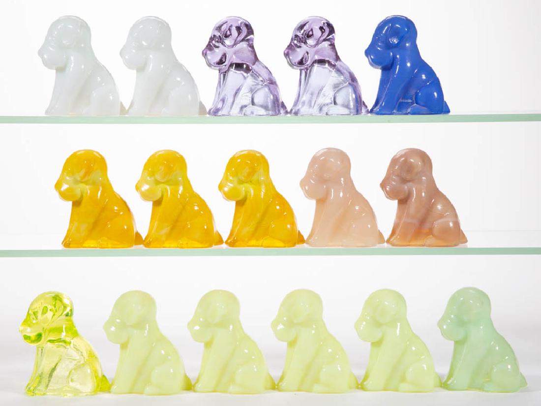 DEGENHART GLASS DOG / POOCH FIGURES, LOT OF 16: DEGENHART GLASS DOG / POOCH FIGURES, LOT OF 16, various colors, including white and heather bloom. Each with Degenhart "D" mark. Crystal Art Glass Co., Cambridge, OH. Second half 20th century. 3" H.Un