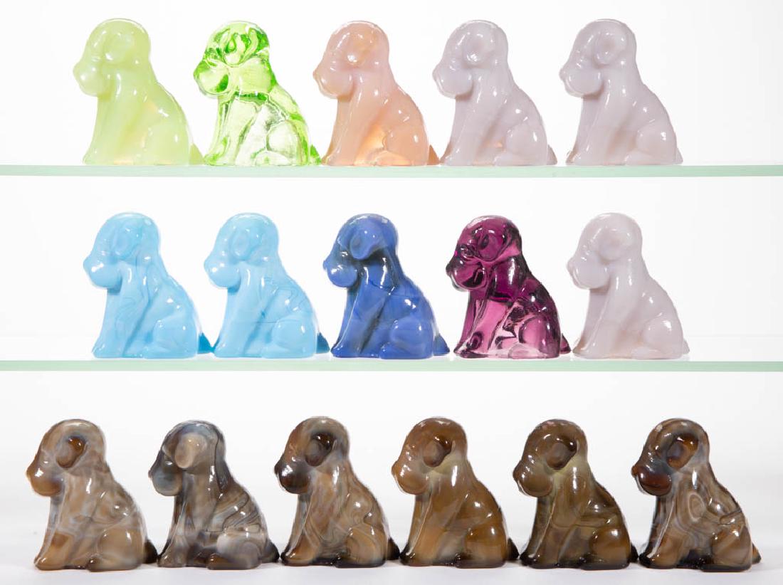 DEGENHART GLASS DOG / POOCH FIGURES, LOT OF 16: DEGENHART GLASS DOG / POOCH FIGURES, LOT OF 16, various colors. Each with Degenhart "D" mark. Crystal Art Glass Co., Cambridge, OH. Second half 20th century. 3" H.Undamaged. Some irregularities as mad