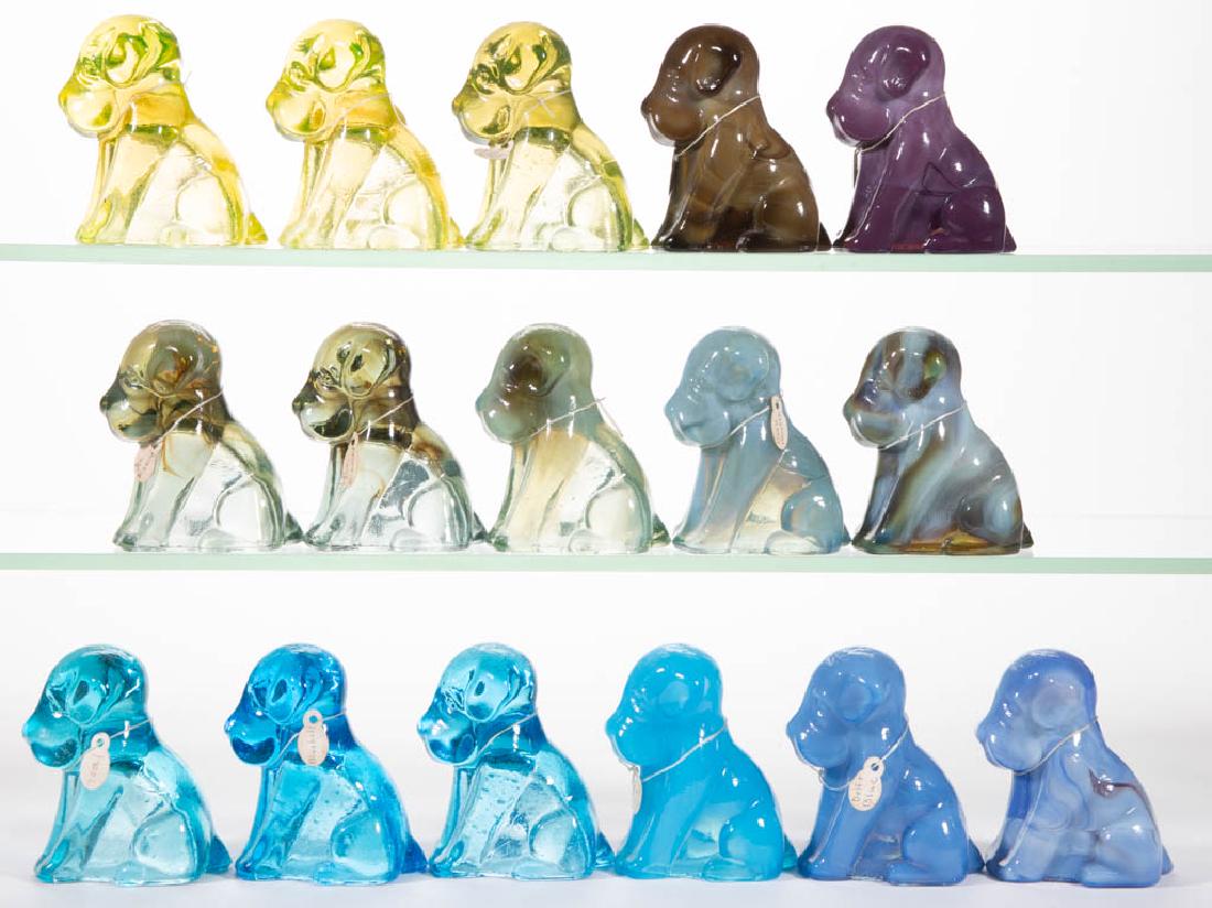 DEGENHART GLASS DOG / POOCH FIGURES, LOT OF 16: DEGENHART GLASS DOG / POOCH FIGURES, LOT OF 16, various colors, including teal and bluebell. Each with Degenhart "D" mark. Crystal Art Glass Co., Cambridge, OH. Second half 20th century. 3" H.Undamage