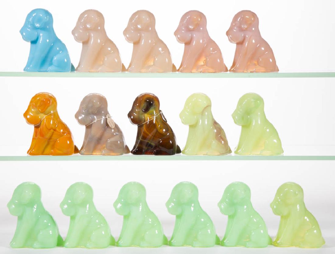 DEGENHART GLASS DOG / POOCH FIGURES, LOT OF 16: DEGENHART GLASS DOG / POOCH FIGURES, LOT OF 16, various colors, including peach slag and bitter sweet slag. Each with Degenhart "D" mark. Crystal Art Glass Co., Cambridge, OH. Second half 20th century