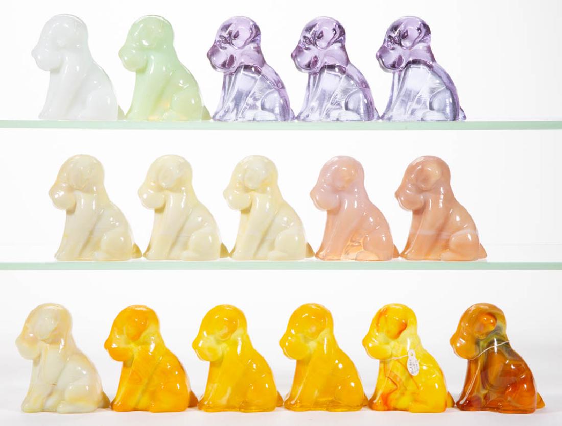DEGENHART GLASS DOG / POOCH FIGURES, LOT OF 16: DEGENHART GLASS DOG / POOCH FIGURES, LOT OF 16, various colors, including bittersweet slag and buttercup slag. Each with Degenhart "D" mark. Crystal Art Glass Co., Cambridge, OH. Second half 20th cent