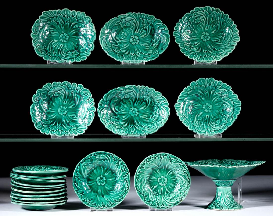 ENGLISH GREEN MAJOLICA CERAMIC CHILDREN'S TOY 19-PIECE: ENGLISH GREEN MAJOLICA CERAMIC CHILDREN'S TOY 19-PIECE FRUIT / DESSERT SET, comprising a 3 1/8" HOA compote, two 4 3/8" x 3 3/4" rectangular dishes, two 4 7/8" x 3 1/2" oval dishes, two 4 1/2" D circu