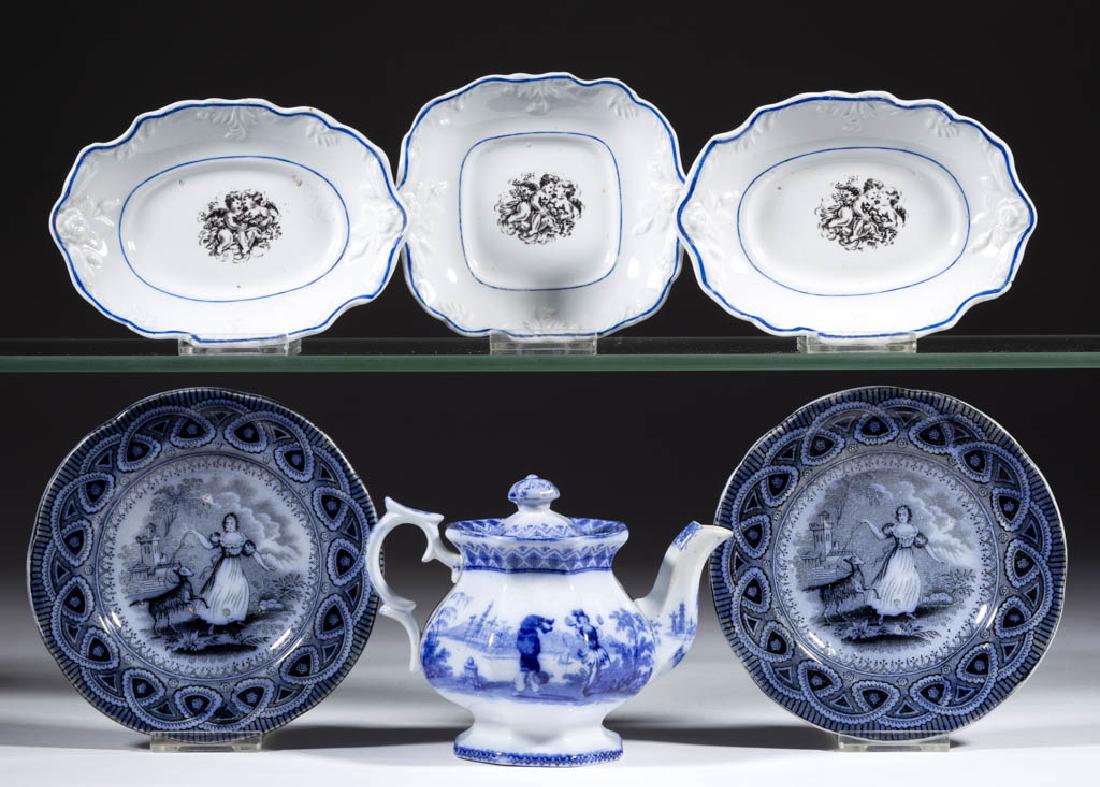 ENGLISH STAFFORDSHIRE TRANSFER-PRINTED CHILDREN'S TOY: ENGLISH STAFFORDSHIRE TRANSFER-PRINTED CHILDREN'S TOY TEA AND TABLE ARTICLES, LOT OF SIX, comprising two 5" x 3 5/8" oval servers and a 4 1/2" x 4" square tray each with central black transfer cherubs