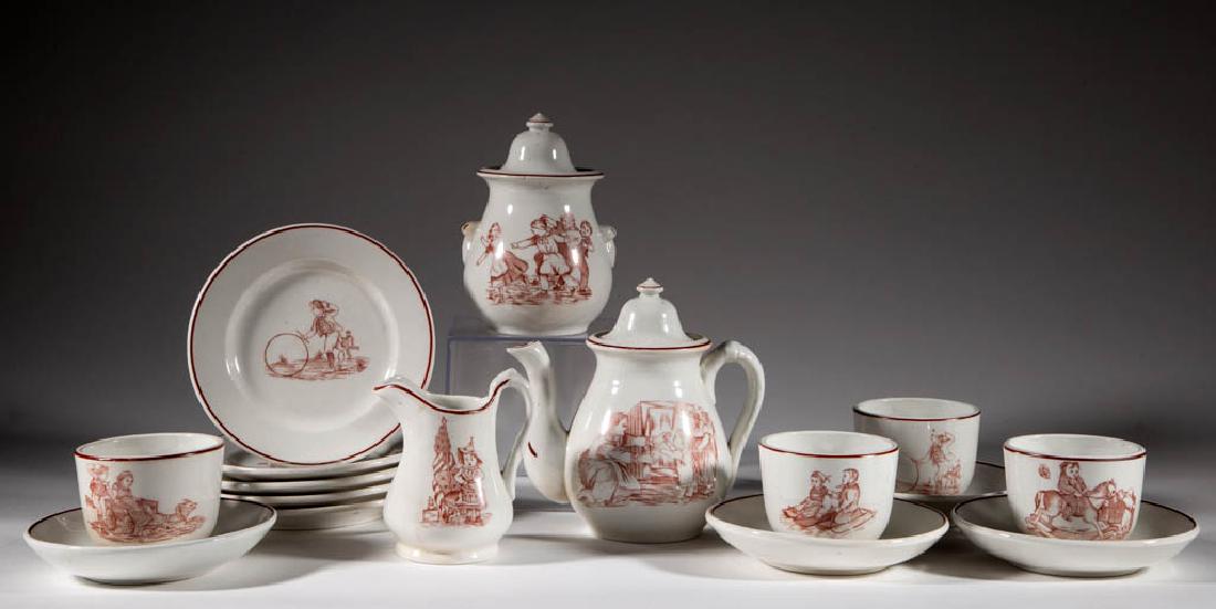 AMERICAN TRANSFER-PRINTED IRONSTONE CERAMIC CHILDREN'S: AMERICAN TRANSFER-PRINTED IRONSTONE CERAMIC CHILDREN'S TOY 16-PIECE TEA SET, comprising a covered teapot, a covered sugar, a creamer, four cups and saucers, and five 5 1/8" D plates, each having overg