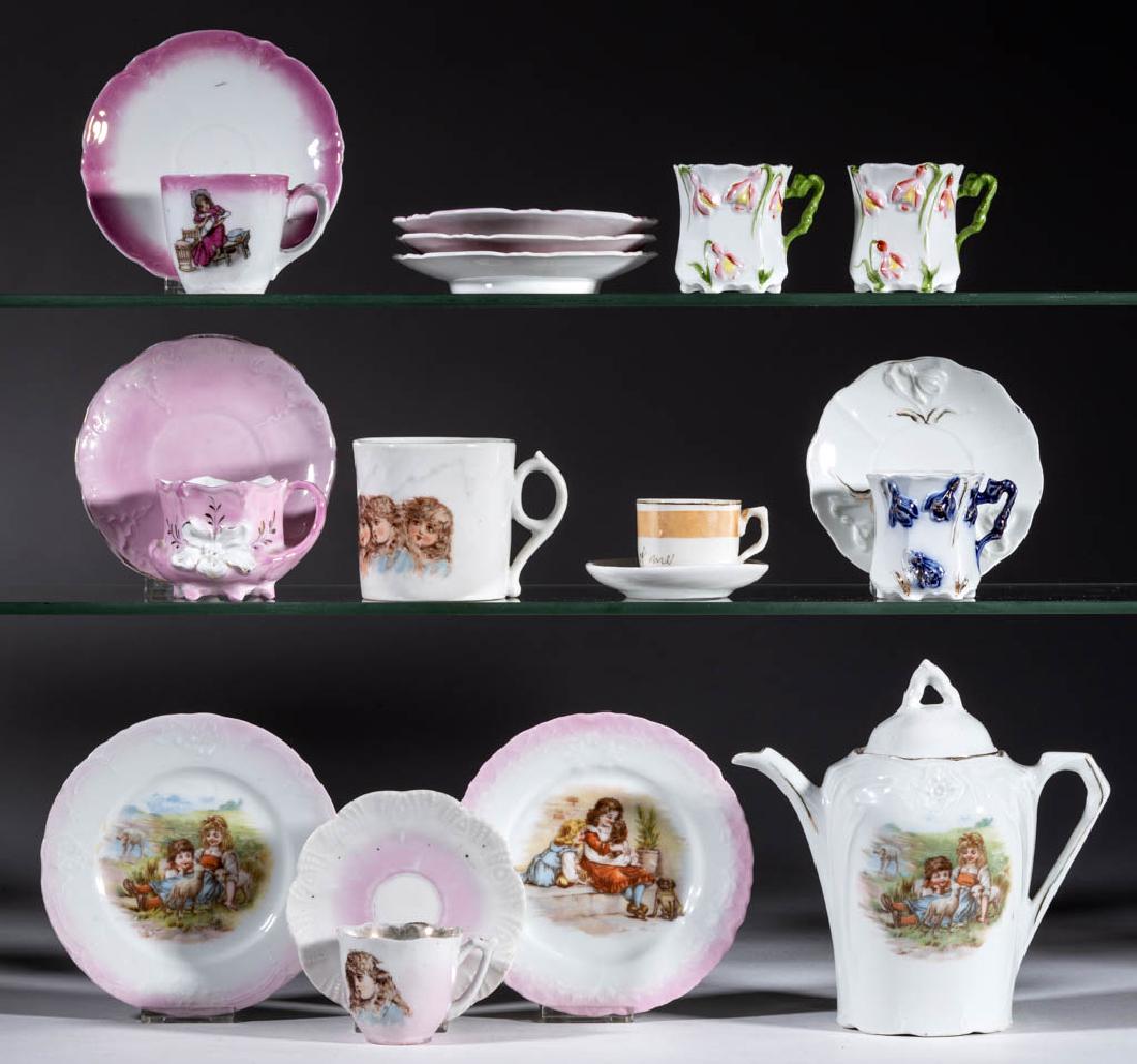 CONTINENTAL PORCELAIN CHILDREN'S TOY TEA ARTICLES, LOT: CONTINENTAL PORCELAIN CHILDREN'S TOY TEA ARTICLES, LOT OF 19, including a mug and cup and saucer set with "Brundage Girls" decal decoration, two plates and one covered teapot with "Girl, Dog, Chicken,