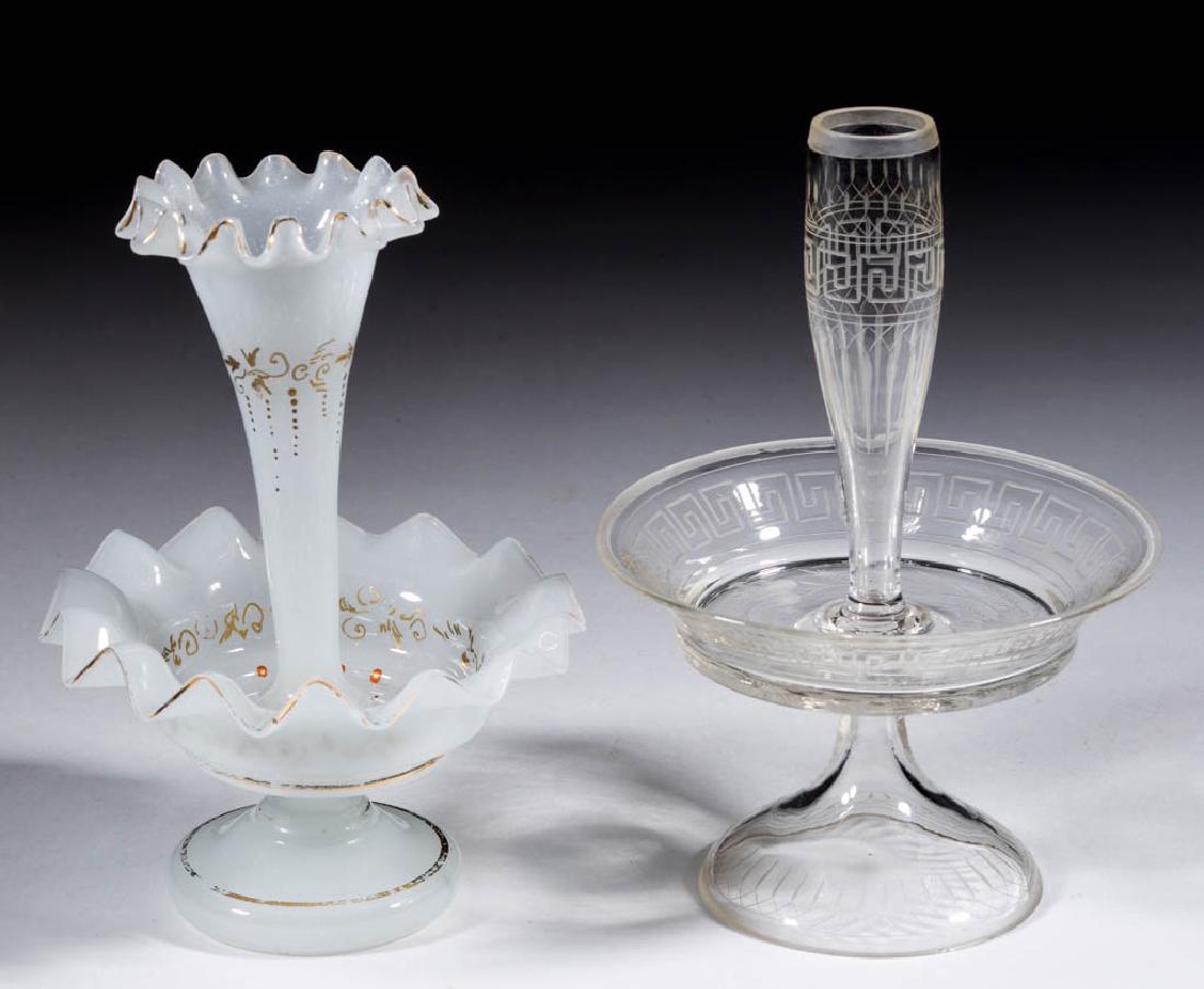 ASSORTED GLASS CHILDREN'S TOY EPERGNES, LOT OF TWO: ASSORTED GLASS CHILDREN'S TOY EPERGNES, LOT OF TWO, comprising a colorless with engraved Greek Key decoration and a white opaline example with gilt decoration. Various makers. Fourth quarter 19th/firs