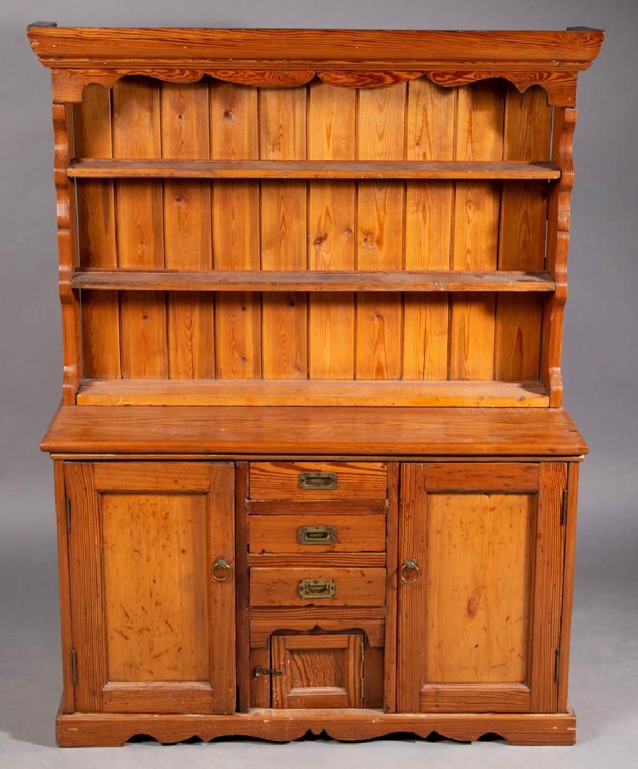 COUNTRY YELLOW PINE CHILD'S PEWTER CUPBOARD: COUNTRY YELLOW PINE CHILD'S PEWTER CUPBOARD, in two sections, open top with molded cornice above three shelves, bottom with two fielded-panel doors flanking a stack of three dovetailed drawers and a s