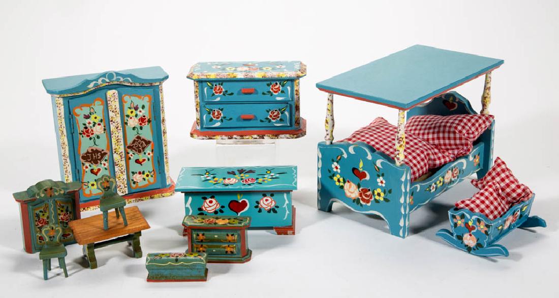 PAINTED DOLLHOUSE / MINIATURE BEDROOM FURNITURE, LOT OF: PAINTED DOLLHOUSE / MINIATURE BEDROOM FURNITURE, LOT OF 11, comprising a bed, two blanket chests, two chest of drawers, two wardrobes, a cradle, and a table with two chair. Larger blanket chest with "