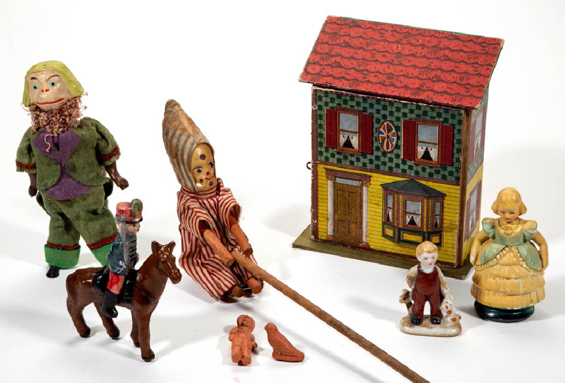 ASSORTED VINTAGE TOYS AND FIGURES, LOT OF NINE: ASSORTED VINTAGE TOYS AND FIGURES, LOT OF NINE, comprising a wind-up monkey, a soldier riding a horse, a miniature bird, a miniature girl, a porcelain boy with dog, a clown with celluloid/plastic face