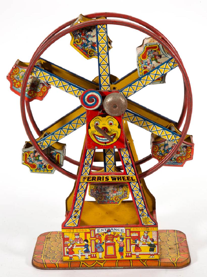 CHEIN "HERCULES" TIN WIND-UP FERRIS WHEEL TOY: CHEIN "HERCULES" TIN WIND-UP FERRIS WHEEL TOY, with six cars and extensive lithographic decoration. Circa 1930. 16 3/4" HOA.Good overall working condition with moderate areas of wear and discoloration