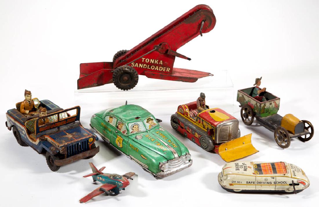 ASSORTED VINTAGE TIN AND PRESSED-STEEL TOYS, LOT OF: ASSORTED VINTAGE TIN AND PRESSED-STEEL TOYS, LOT OF SEVEN, including a Dick Tracy Squad car wind-up example by Marx and a Japanese bulldozer by Marusan Toys. Mid 20th century. 4 1/4" to 12 3/4" LOA. A