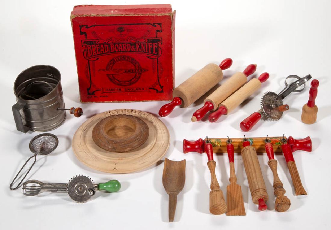 CHILDREN'S / TOY KITCHEN ITEMS, LOT OF 18-PIECES: CHILDREN'S / TOY KITCHEN ITEMS, LOT OF 18-PIECES, wooden and tin, including assorted utensils and a carved wood bread board with original box lettered for Dover Toys, England. First half 20th century.