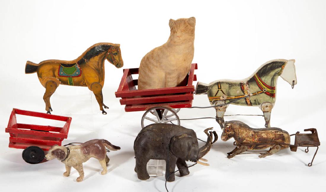 ASSORTED CHILDREN'S TOY ARTICLES, LOT OF EIGHT: ASSORTED CHILDREN'S TOY ARTICLES, LOT OF EIGHT, including a plush cat, dog candy container, and an elephant. Fourth quarter 19th/early 20th century. 6" H cat. Elephant and horse example with heavy los