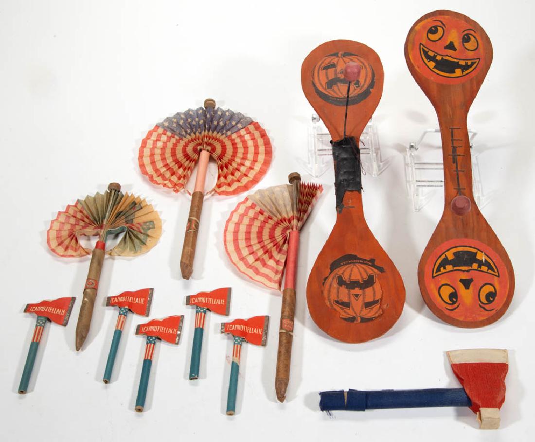 VINTAGE HALLOWEEN AND PATRIOTIC ARTICLES, LOT OF 11: VINTAGE HALLOWEEN AND PATRIOTIC ARTICLES, LOT OF 11, comprising two wooden paddle noise makers with jack-o-lantern decoration, three American flag cigar fans, and six miniature axes. Cigar fans with "