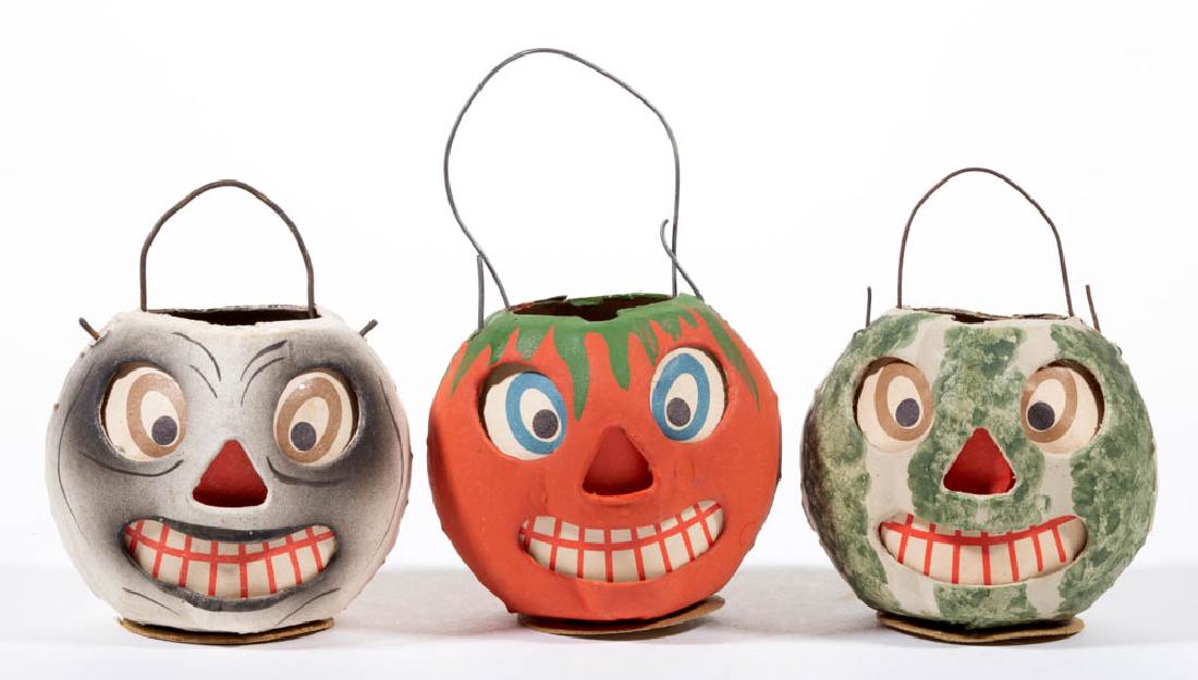 GERMAN HALLOWEEN COMPOSITION / CARDBOARD MINIATURE: GERMAN HALLOWEEN COMPOSITION / CARDBOARD MINIATURE JACK-O-LANTERNS, LOT OF THREE, each having painted finish and original printed paper insert, interior candle holder, wire hanging handle. Each with p