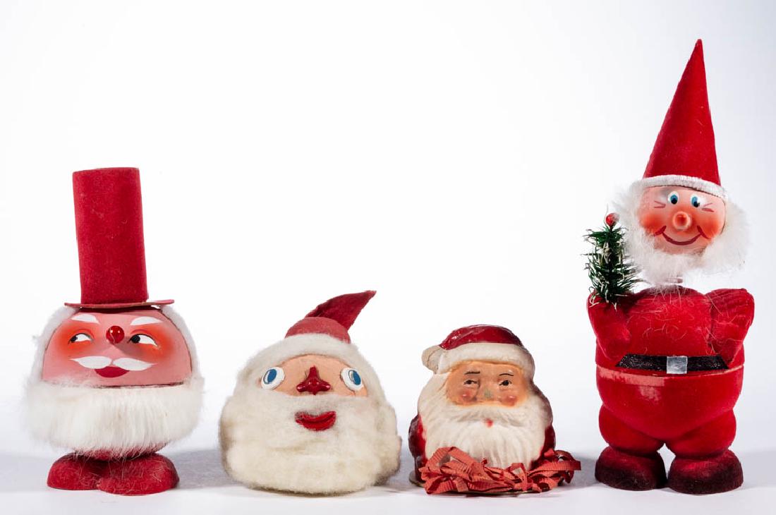 GERMAN AND OTHER SANTA CLAUS FIGURES, LOT OF FOUR: GERMAN AND OTHER SANTA CLAUS FIGURES, LOT OF FOUR, comprising a candy container with bobblehead, a candy container with bell in tall top hat, a barrel bank for James' Original Salt Water Taffy, and a 