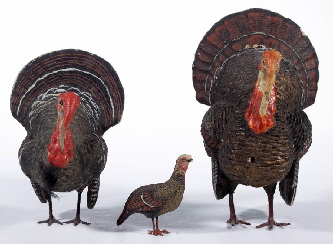 GERMAN COMPOSITION / PAPIER-MACHE TURKEY CANDY: GERMAN COMPOSITION / PAPIER-MACHE TURKEY CANDY CONTAINERS, LOT OF TWO, each having removable head and metal feet. Each with printed "Germany" mark to interior of cover. Together with a small turkey fi