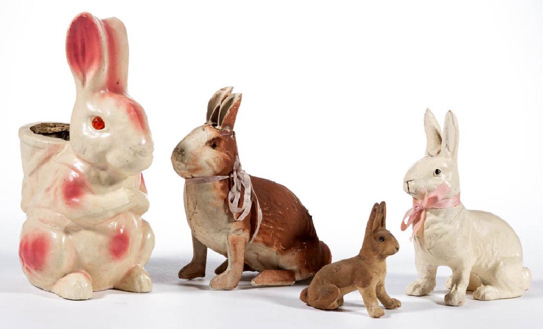 GERMAN AND OTHER COMPOSITION / PAPIER-MACHE RABBIT: GERMAN AND OTHER COMPOSITION / PAPIER-MACHE RABBIT FIGURES, LOT OF FOUR, each with polychrome finish, including a white and pink candy container example. White example with embossed "MADE IN / U S A" 