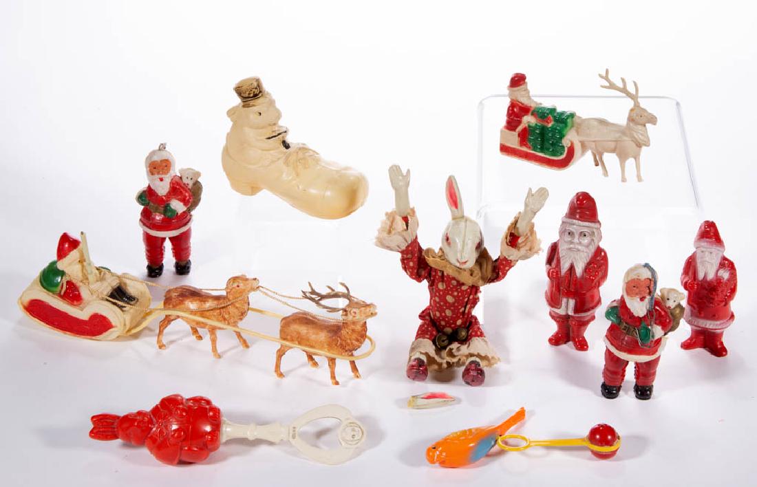 ASSORTED CELLULOID / PLASTIC FIGURAL TOYS, LOT OF TEN: ASSORTED CELLULOID / PLASTIC FIGURAL TOYS, LOT OF TEN, comprising six Santa Claus examples with two on sleighs, a bunny in a shoe, a wind-up rabbit, a rabbit rattle, and a bird balancing example. Shor