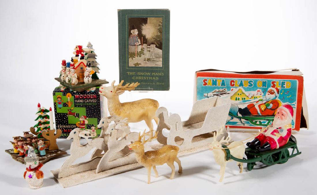 ASSORTED CHRISTMAS / HOLIDAY ARTICLES, LOT OF EIGHT: ASSORTED CHRISTMAS / HOLIDAY ARTICLES, LOT OF EIGHT, comprising a "Santa Claus on Sled" wind-up toy, two celluloid/plastic deer figures, a pasteboard sleigh and deer figure, two wooden expansion ornam