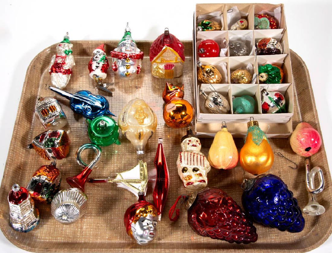 ASSORTED GLASS FIGURAL CHRISTMAS ORNAMENTS, LOT OF 35: ASSORTED GLASS FIGURAL CHRISTMAS ORNAMENTS, LOT OF 35, including two Kugel-type grape clusters, a mushroom, a Santa Claus clip, a sail boat, and three pears. 20th century. Blue grapes 4" HOA.Each with