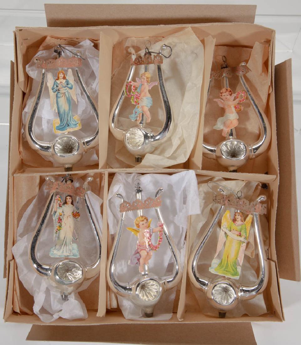 GLASS AND LITHOGRAPH CHRISTMAS ORNAMENTS, SET OF SIX: GLASS AND LITHOGRAPH CHRISTMAS ORNAMENTS, SET OF SIX, each having a lyre-shaped glass base with paper angel figures attached to center. Unmarked. First half 20th century. One 2 7/8" WOA, 5" HOA. Each 