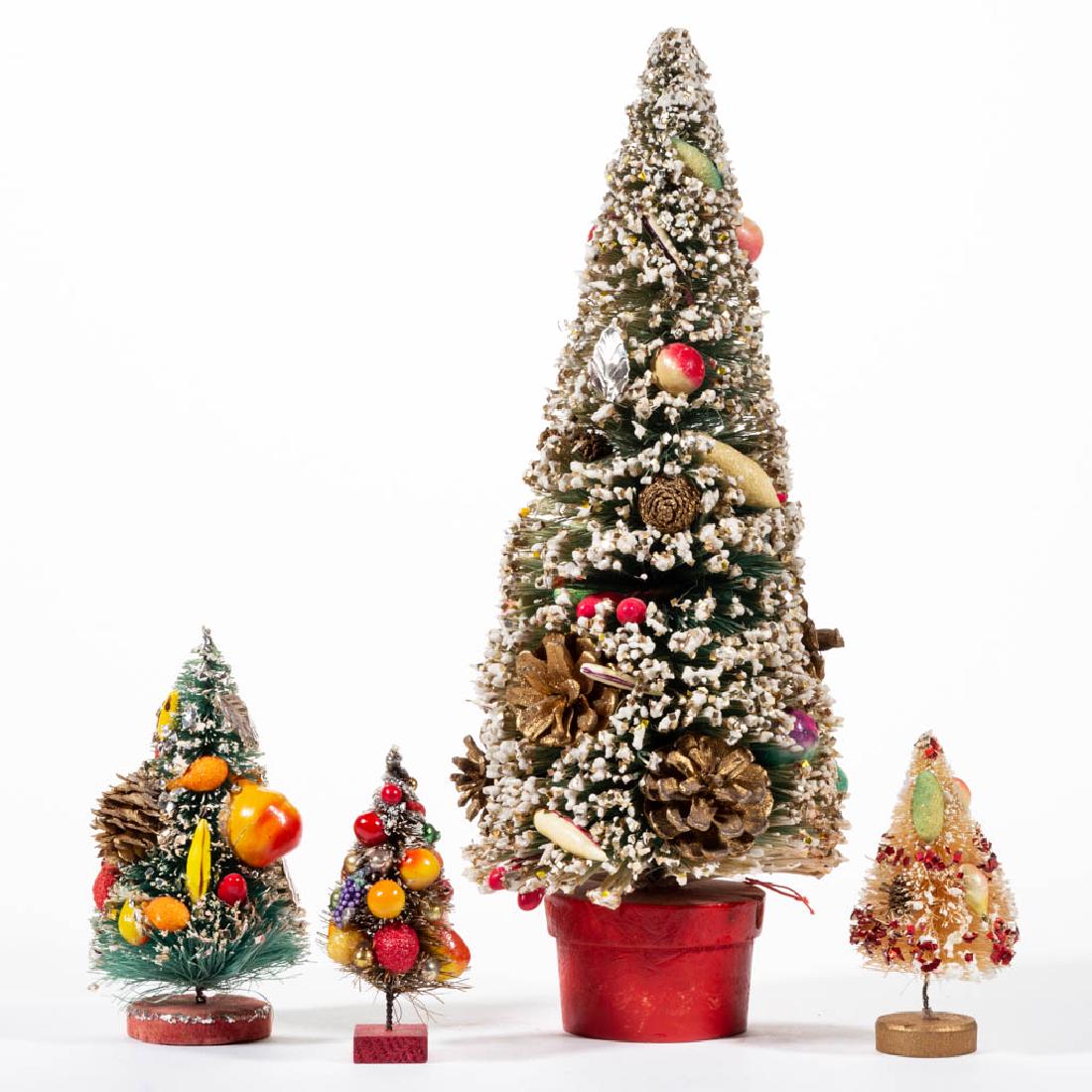 JAPANESE AND OTHER MINIATURE CHRISTMAS TREES, LOT OF: JAPANESE AND OTHER MINIATURE CHRISTMAS TREES, LOT OF FOUR, each having faux snow accents and fruit decoration, resting on painted wooden bases. Two with "H / JAPAN / H" labels, otherwise unmarked. 20t