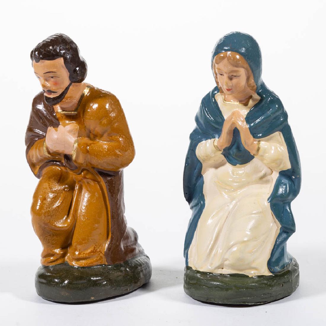 GERMAN COMPOSITION / PAPIER-MACHE MARY AND JOSEPH: GERMAN COMPOSITION / PAPIER-MACHE MARY AND JOSEPH FIGURES, SET OF TWO, each depicted in a kneeling stance with head slightly bowing, having polychrome-painted finish. Each with printed "Made in US.-Zo