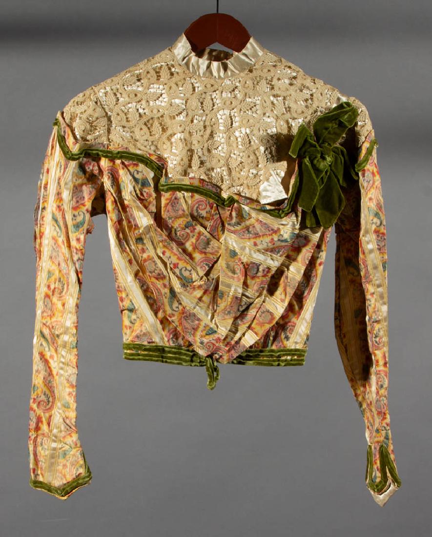 VINTAGE LADY'S COTTON AND SILK JACKET: VINTAGE LADY'S COTTON AND SILK JACKET, white with leaf and scroll tatting to front and back, front folds over the shoulder and hooks in the back, arms and lower body in a multi-color silk stylized pat