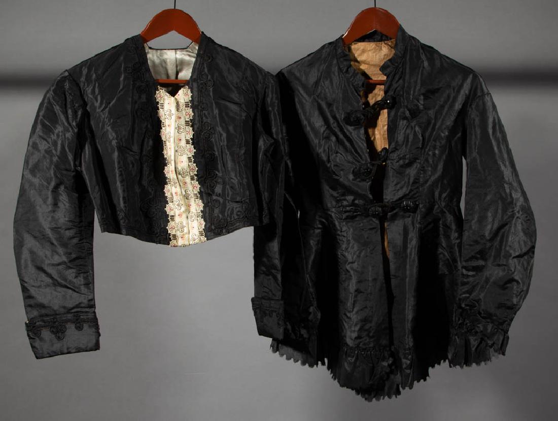 VICTORIAN / EDWARDIAN BLACK CLOTHING, LOT OF FIVE: VICTORIAN / EDWARDIAN BLACK CLOTHING, LOT OF FIVE, comprising a jacket with decorative trim, a jacket with scalloped trim, and three plain skirts in various styles. Late 19th/early 20th century. Jacke