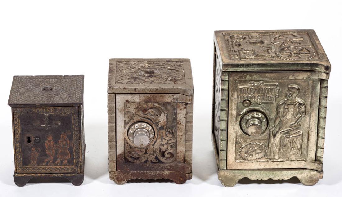 ASSORTED SAFE CAST-IRON PENNY / STILL BANKS, LOT OF: ASSORTED SAFE CAST-IRON PENNY / STILL BANKS, LOT OF THREE, including a Roller Safe, by Kyser & Rex, with original paint; and a nickel-plated Bank Of Industry, by Kenton. Late 19th/early 20th century. 