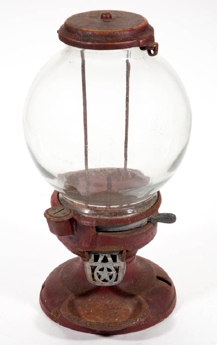 VINTAGE AMERICAN GUMBALL MACHINE: VINTAGE AMERICAN GUMBALL MACHINE, cast-iron footed base marked with indistinct patent date to rim of tray. Original red-painted base and lid. Probably Columbus Vending Co. Circa 1920. 16 1/4" HOA.Unkn