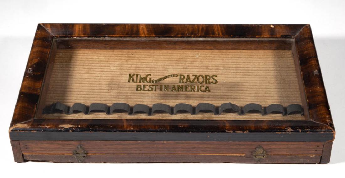 KING RAZORS COUNTRY STORE COUNTER-TOP DISPLAY: KING RAZORS COUNTRY STORE COUNTER-TOP DISPLAY, oak case, glass front with gilt-lettering "King Guaranteed Razors Best in America", straps for 12 straight razors, First quarter 20th century. 8 3/4" H, 