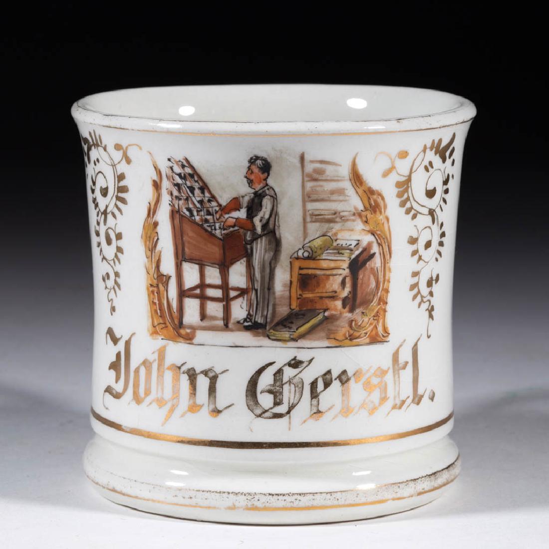 GERMAN PORCELAIN TYPESETTER / PRINTER OCCUPATIONAL: GERMAN PORCELAIN TYPESETTER / PRINTER OCCUPATIONAL SHAVING MUG, hand-painted with a scene of a man choosing type from a printer's cabinet with "John Gerstl." printed in gilt below. Unmarked. Late 19th