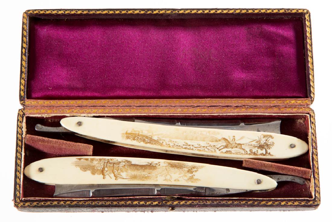 ENGLISH CASED PAIR OF STRAIGHT RAZORS: ENGLISH CASED PAIR OF STRAIGHT RAZORS, each with scrimshaw decorated bone handles, depicting fox and bird hunting in the countryside, tangs stamped "J. Fox", with the head of the blade stamped "F MILL