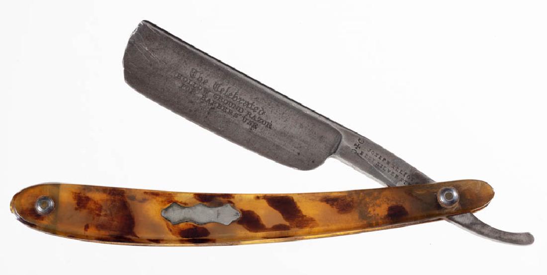 ENGLISH MOTTLED HORN-HANDLED STRAIGHT RAZOR: ENGLISH MOTTLED HORN-HANDLED STRAIGHT RAZOR, with inlaid escutcheon plate, tang stamped "Joseph Elliots Best Silver Steel" with hallmarks, blade is etched "The Celebrated Hollow Ground Razor For Barbe
