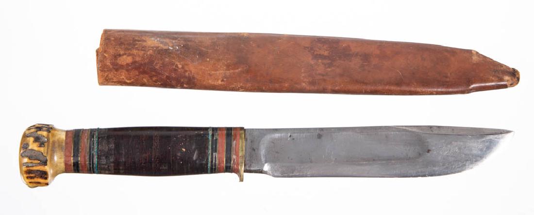 MARBLE'S ARMS & MANUFACTURING CO. HUNTING / BOWIE KNIFE: MARBLE'S ARMS & MANUFACTURING CO. HUNTING / BOWIE KNIFE, leather-wrapped handle with stag pommel, tang marked "Marble's Gladstone, Mich. U.S.A", including old leather sheath. First quarter 20th centur