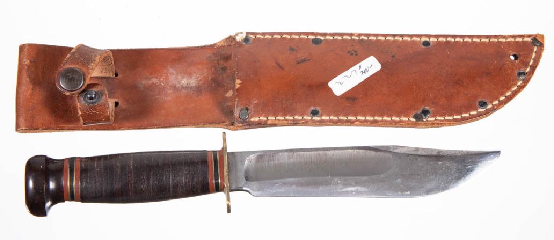 MARBLE'S ARMS & MANUFACTURING CO. HUNTING KNIFE: MARBLE'S ARMS & MANUFACTURING CO. HUNTING KNIFE, leather-wrapped handle with Bakelite pommel, tang marked "Marble's Gladstone, Mich. U.S.A.", full guard, including old possibly original leather sheath