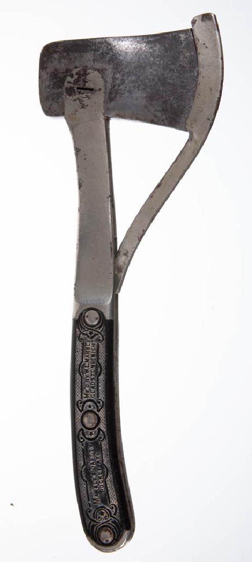 MARBLE'S ARMS & MANUFACTURING CO. CLEVIS TYPE 2 SAFETY: MARBLE'S ARMS & MANUFACTURING CO. CLEVIS TYPE 2 SAFETY HATCHET / AXE, metal handle with synthetic grips marked "Marble's Safety Pocket Axe, Mf'd by W.L. Marble Gladstone, Mich." with a dog chasing a r