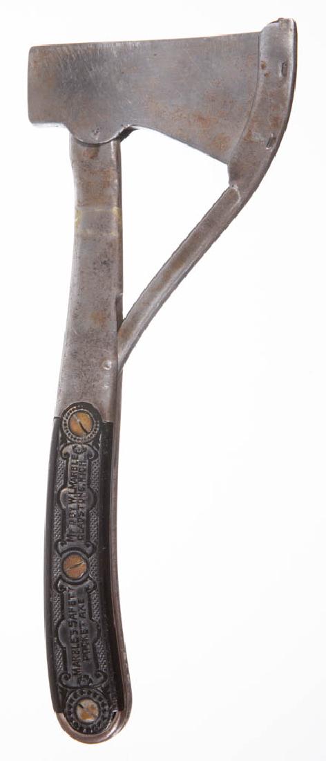MARBLE'S ARMS & MANUFACTURING CO. NO. 1 SAFETY HATCHET: MARBLE'S ARMS & MANUFACTURING CO. NO. 1 SAFETY HATCHET / AXE, metal handle with synthetic grips marked "Marble's Safety Pocket Axe, Mf'd by W.L. Marble Gladstone, Mich.", with a dog chasing a rabbit o