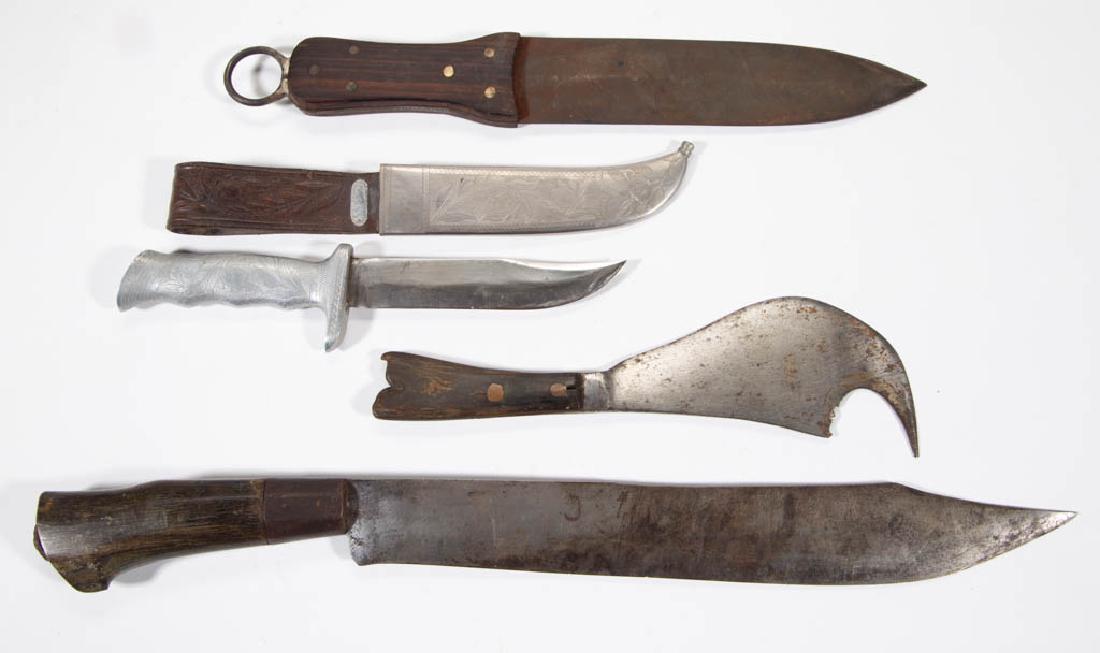 VARIOUS EDGED KNIVES, LOT OF FOUR: VARIOUS EDGED KNIVES, LOT OF FOUR, comprising a machete inscribed with a "J", kukri, double edged knife with hanger, and an engraved knife and sheath with leather frog. 19th/first half of 20th century