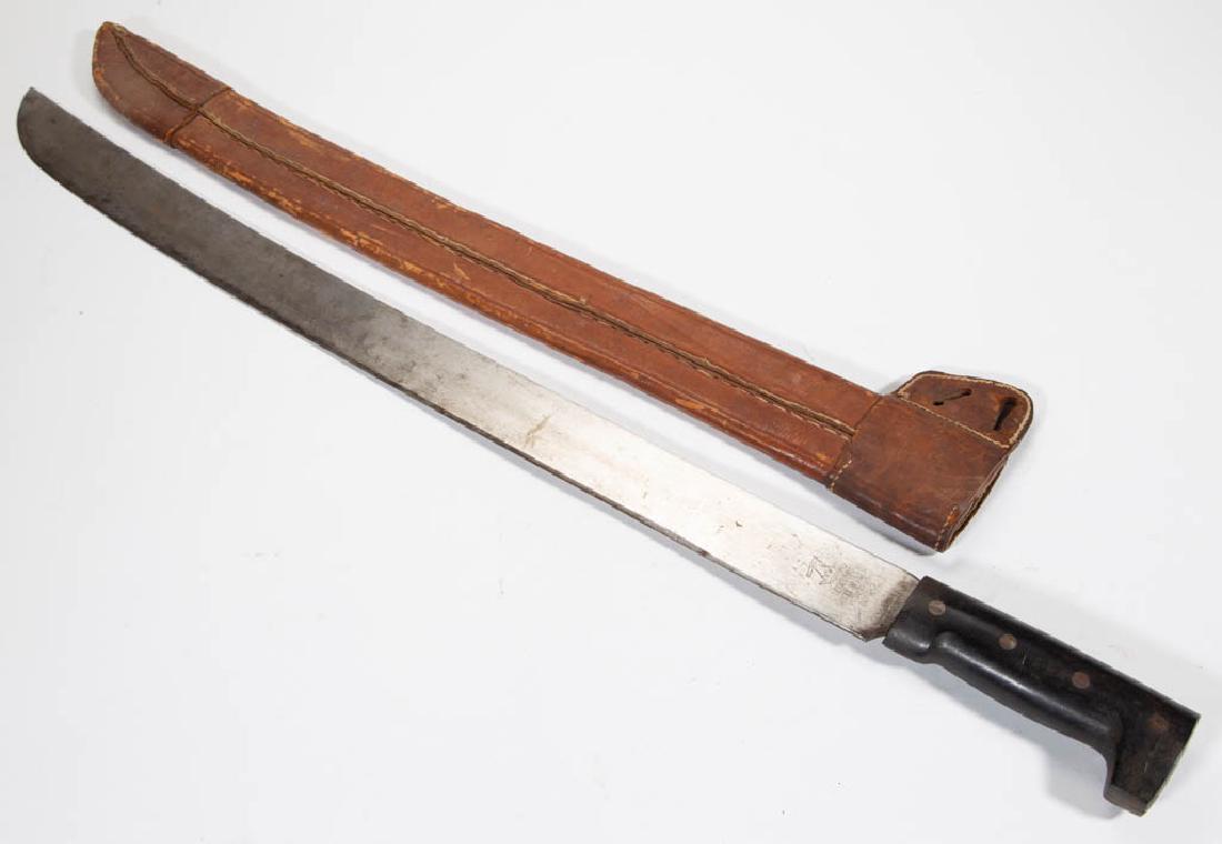 LEGITIMUS COLLINS & CO. MACHETE: LEGITIMUS COLLINS & CO. MACHETE, wooden handle, ricasso marked "Legitimus Collins & Co., Made in USA No. 22", with original leather sheath. First half 20th century. 26" blade, 31" LOA.Good overall con