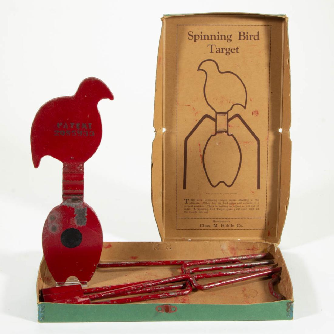 AMERICAN FIGURAL PAINTED IRON SPINNING TARGET: AMERICAN FIGURAL PAINTED IRON SPINNING TARGET, manufactured by Chas. M. Biddle Co., patent date stamped on the back of the bird, in original box. Target retains its original red- and black-painted sur