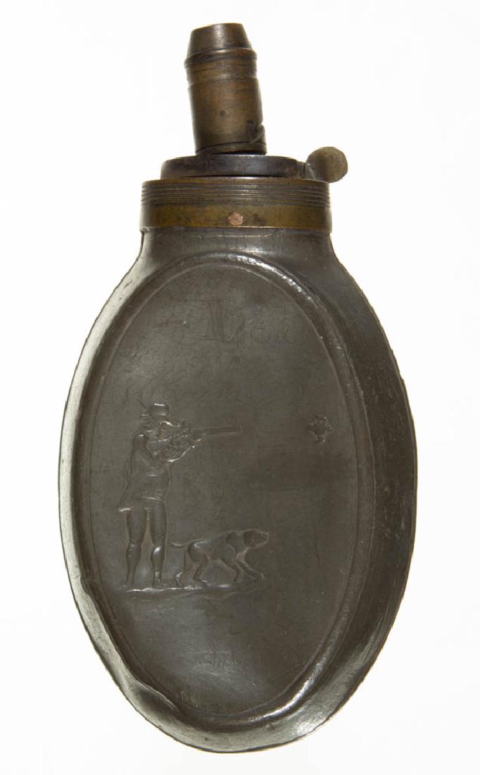 ENGLISH BRASS AND PEWTER POWDER FLASK: ENGLISH BRASS AND PEWTER POWDER FLASK, stamped "Dixon & Son", with embossed decoration of gentleman shooting at a bird with his dog, multiple inscriptions written throughout the flask, possibly diary 