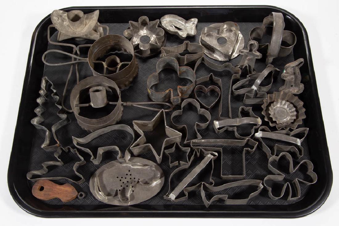 MID-ATLANTIC SHEET-IRON FIGURAL TIN COOKIE / DOUGH: MID-ATLANTIC SHEET-IRON FIGURAL TIN COOKIE / DOUGH CUTTERS, LOT OF 29, including three doughnut cutters, cat, fish, hatchet, rabbit, star, shamrock, Christmas tree, heart; five cookie cutters with han