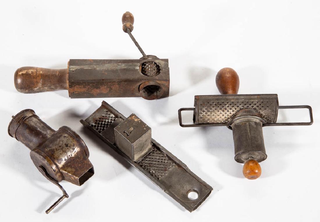 ASSORTED TIN / SHEET-IRON NUTMEG GRATERS, LOT OF FOUR: ASSORTED TIN / SHEET-IRON NUTMEG GRATERS, LOT OF FOUR, comprising two with hand-cranks, one with a sliding mechanism and stamped "The Boyle Nutmeg Grater", and "The Edgar" style example. Fourth quarte