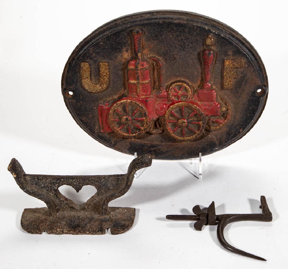 AMERICAN CAST / WROUGHT-IRON ARTICLES, LOT OF TWO: AMERICAN CAST / WROUGHT-IRON ARTICLES, LOT OF TWO, including a boot scraper with a heart cut-out. Together with a vice. Three pieces total. 19th and 20th century. 3 3/4" H boot scraper. Boot scraper w